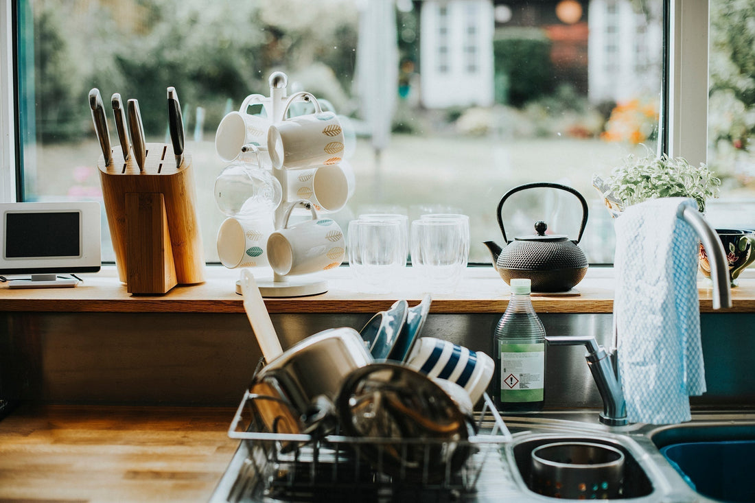 standing at the sink \ an unnoticed pause